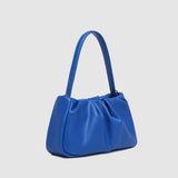 Blue handbag on a light gray background