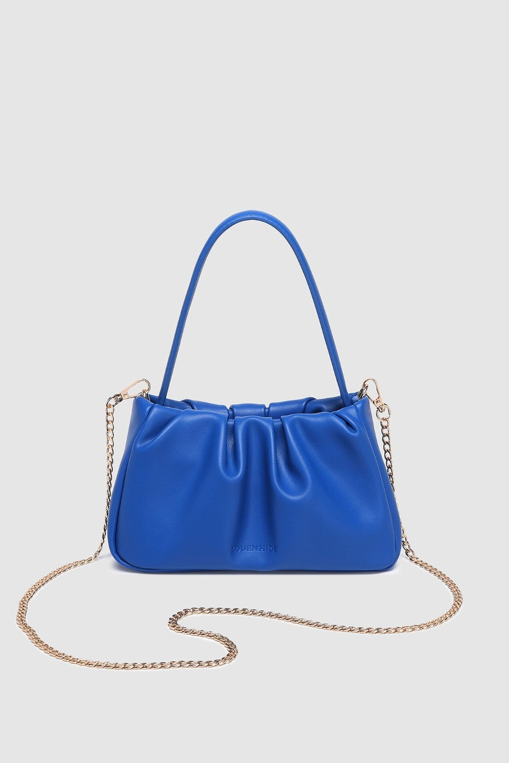 Blue handbag with a chain detail on a light gray background