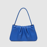 Blue handbag on a light gray background