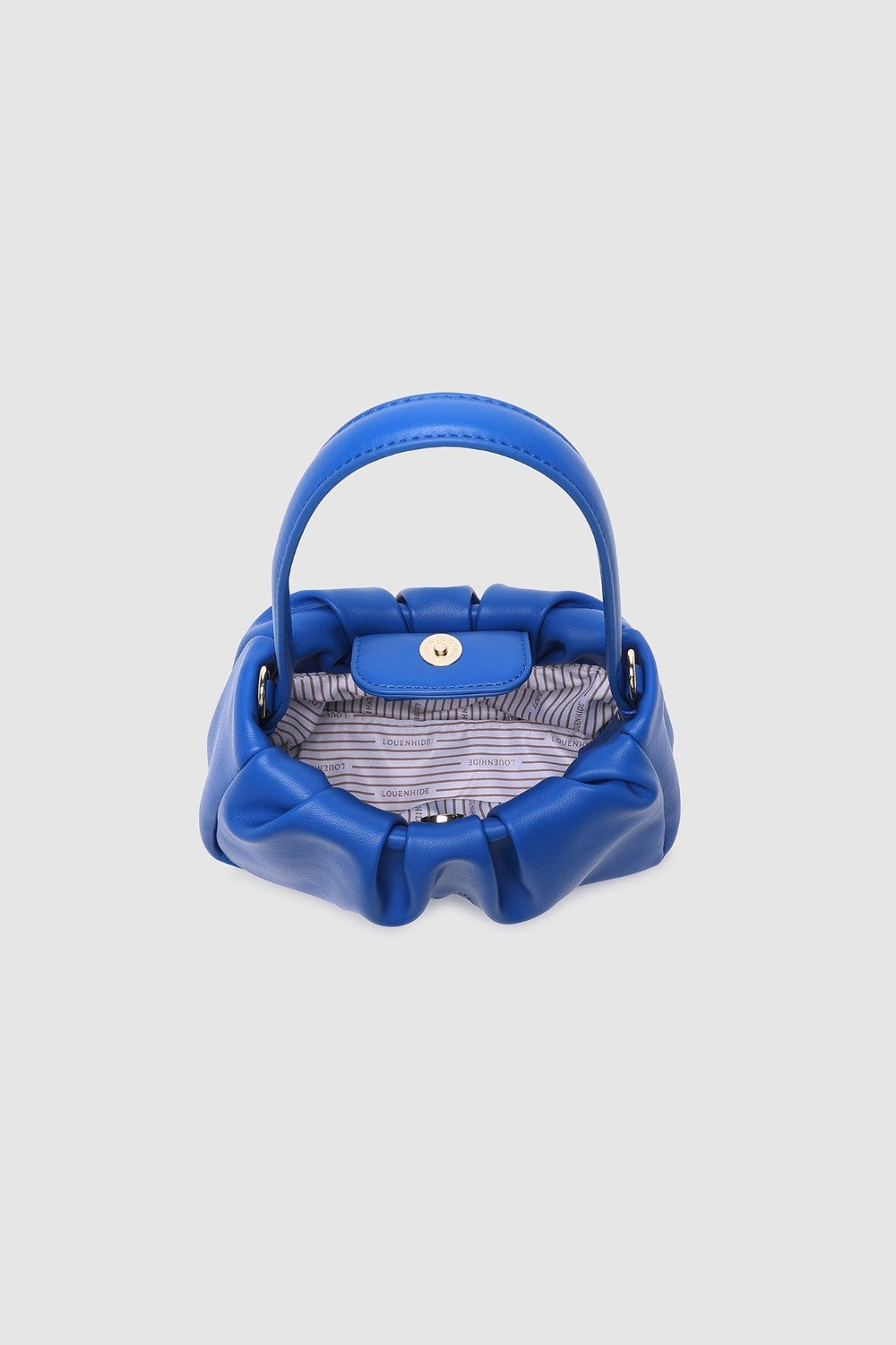 Blue handbag with striped lining on a light gray background