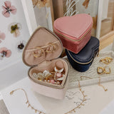 The Louenhide Valerie Jewelry Box is the perfect travelling accessory to store your beloved jewelry collection. Keep your essentials organized and at the ready, in this cute jewelry case. Thoughtfully designed with an elasticated pocket for small rings or earrings and compartment space for your larger items. A thoughtful gift for bridesmaids, birthdays or someone special in your life.