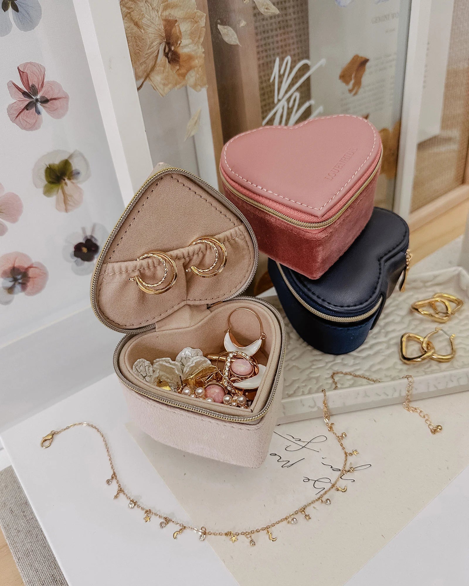 The Louenhide Valerie Jewelry Box is the perfect travelling accessory to store your beloved jewelry collection. Keep your essentials organized and at the ready, in this cute jewelry case. Thoughtfully designed with an elasticated pocket for small rings or earrings and compartment space for your larger items. A thoughtful gift for bridesmaids, birthdays or someone special in your life.