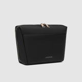 Black pouch with gold zipper on a light gray background