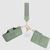 Green pleather pouch with strap and card holder on a white background
