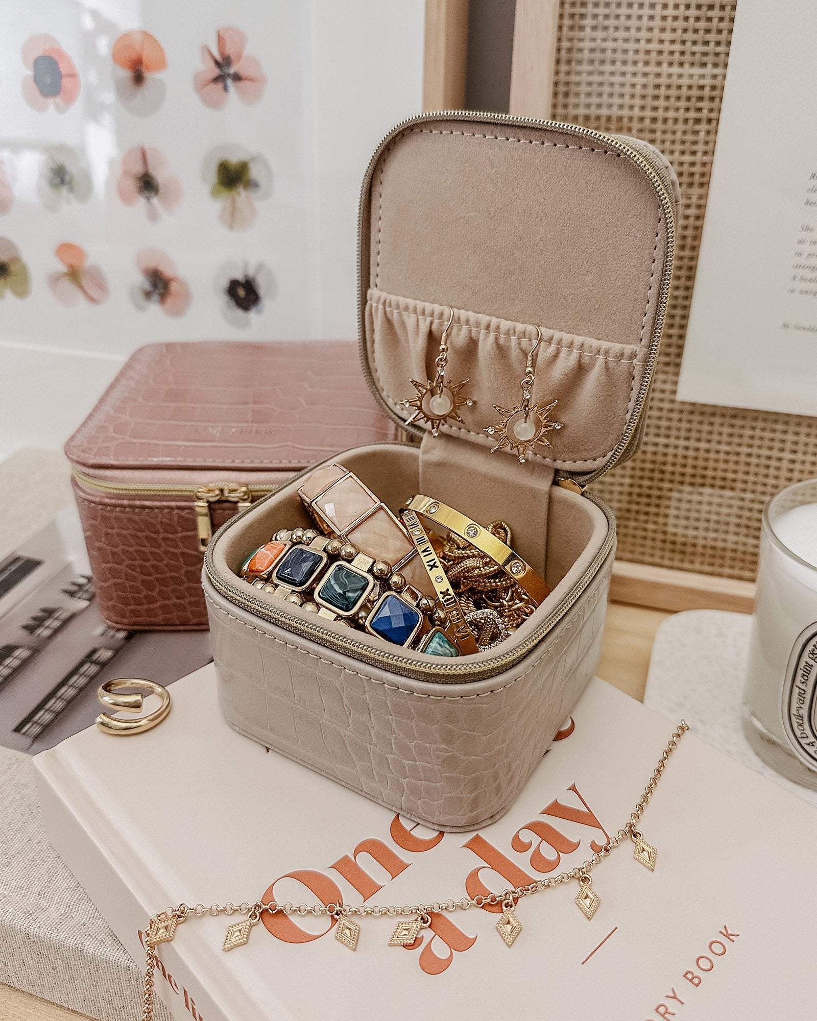 The Louenhide Beau Jewelry Box is a small, square jewellery organizer designed to keep your&nbsp; pieces safe and secure at home or when you are on the go. Featuring a vegan croc exterior,&nbsp;&nbsp;the Beau&nbsp;is every woman's dream jewelry case!&nbsp; Store your larger pieces in the main compartment, while safely stowing your smaller jewels in the elasticated slip pocket