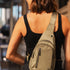 The Louenhide Boyd Nylon Sling Bag is an on-trend unisex sling bag designed with both style and functionality in mind. Organisation has never been easier with the three-section design, your valuables are within easy reach and secured safely with the stylish gunmetal zippers. Whether you're chasing an urban aesthetic or embodying an off-duty street style, this unisex nylon sling bag adapts to any casual outfit, enhancing your personal style while still offering ultimate practicality. The Boyd Khaki features 