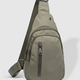 The Louenhide Boyd Nylon Sling Bag is an on-trend unisex sling bag designed with both style and functionality in mind. Organisation has never been easier with the three-section design, your valuables are within easy reach and secured safely with the stylish gunmetal zippers. Whether you're chasing an urban aesthetic or embodying an off-duty street style, this unisex nylon sling bag adapts to any casual outfit, enhancing your personal style while still offering ultimate practicality. The Boyd Khaki features 