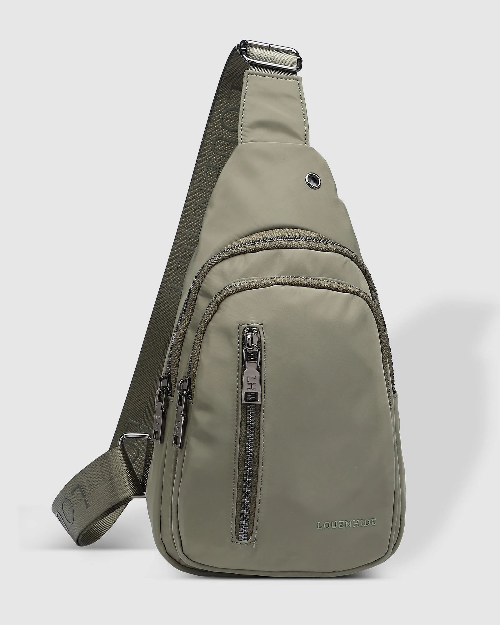The Louenhide Boyd Nylon Sling Bag is an on-trend unisex sling bag designed with both style and functionality in mind. Organisation has never been easier with the three-section design, your valuables are within easy reach and secured safely with the stylish gunmetal zippers. Whether you're chasing an urban aesthetic or embodying an off-duty street style, this unisex nylon sling bag adapts to any casual outfit, enhancing your personal style while still offering ultimate practicality. The Boyd Khaki features 