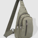 The Louenhide Boyd Nylon Sling Bag is an on-trend unisex sling bag designed with both style and functionality in mind. Organisation has never been easier with the three-section design, your valuables are within easy reach and secured safely with the stylish gunmetal zippers. Whether you're chasing an urban aesthetic or embodying an off-duty street style, this unisex nylon sling bag adapts to any casual outfit, enhancing your personal style while still offering ultimate practicality. The Boyd Khaki features 