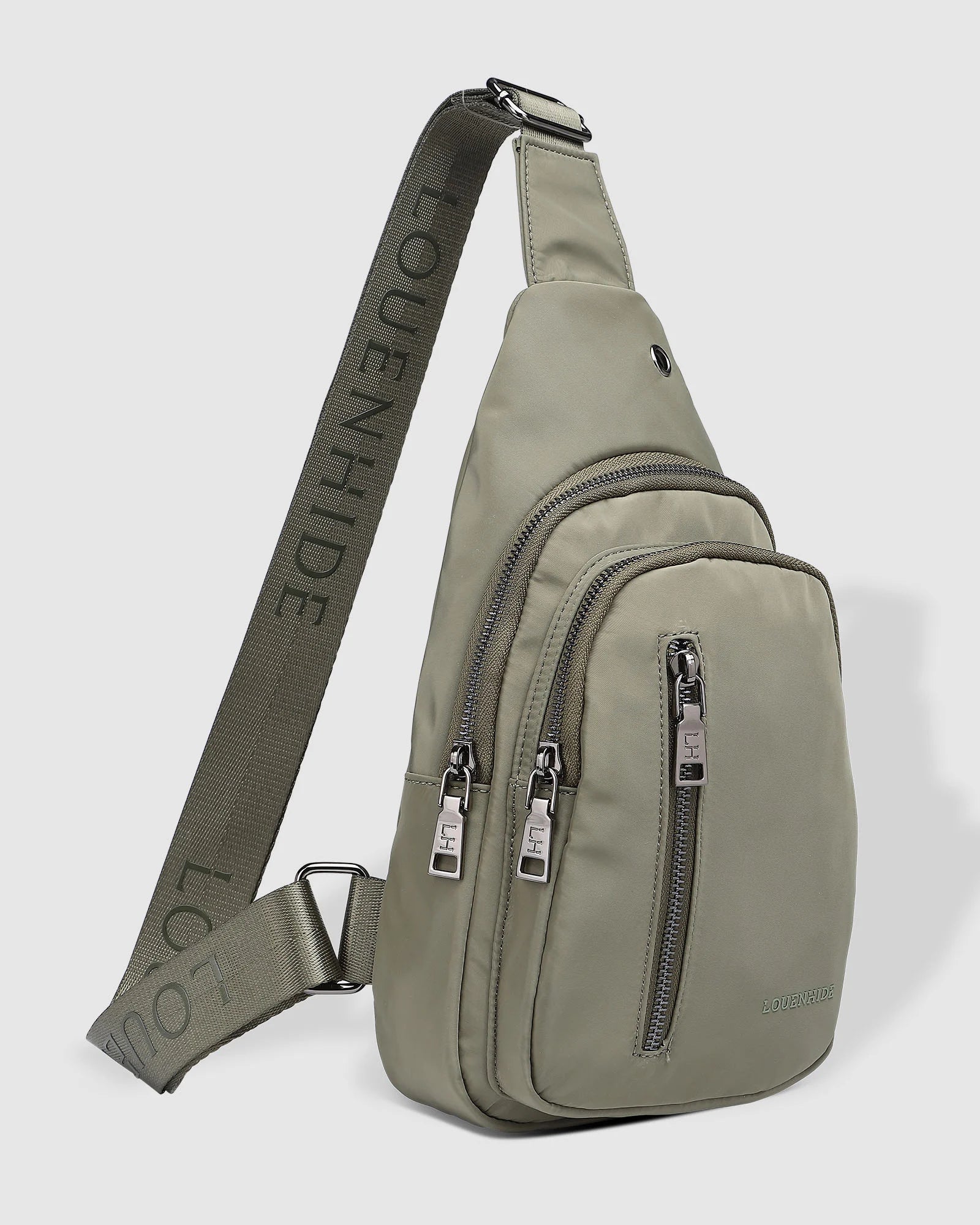 The Louenhide Boyd Nylon Sling Bag is an on-trend unisex sling bag designed with both style and functionality in mind. Organisation has never been easier with the three-section design, your valuables are within easy reach and secured safely with the stylish gunmetal zippers. Whether you're chasing an urban aesthetic or embodying an off-duty street style, this unisex nylon sling bag adapts to any casual outfit, enhancing your personal style while still offering ultimate practicality. The Boyd Khaki features 