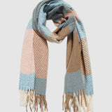 The Louenhide Cambridge Teal Scarf effortlessly combines style and warmth to elevate your winter wardrobe. With its generous size and cool-toned colors, this soft colour block scarf offers endless styling possibilities. Effortlessly drape it over your shoulders for a classic look or loop it for a snug feel. The Cambridge Teal is the perfect cozy winter accessory.