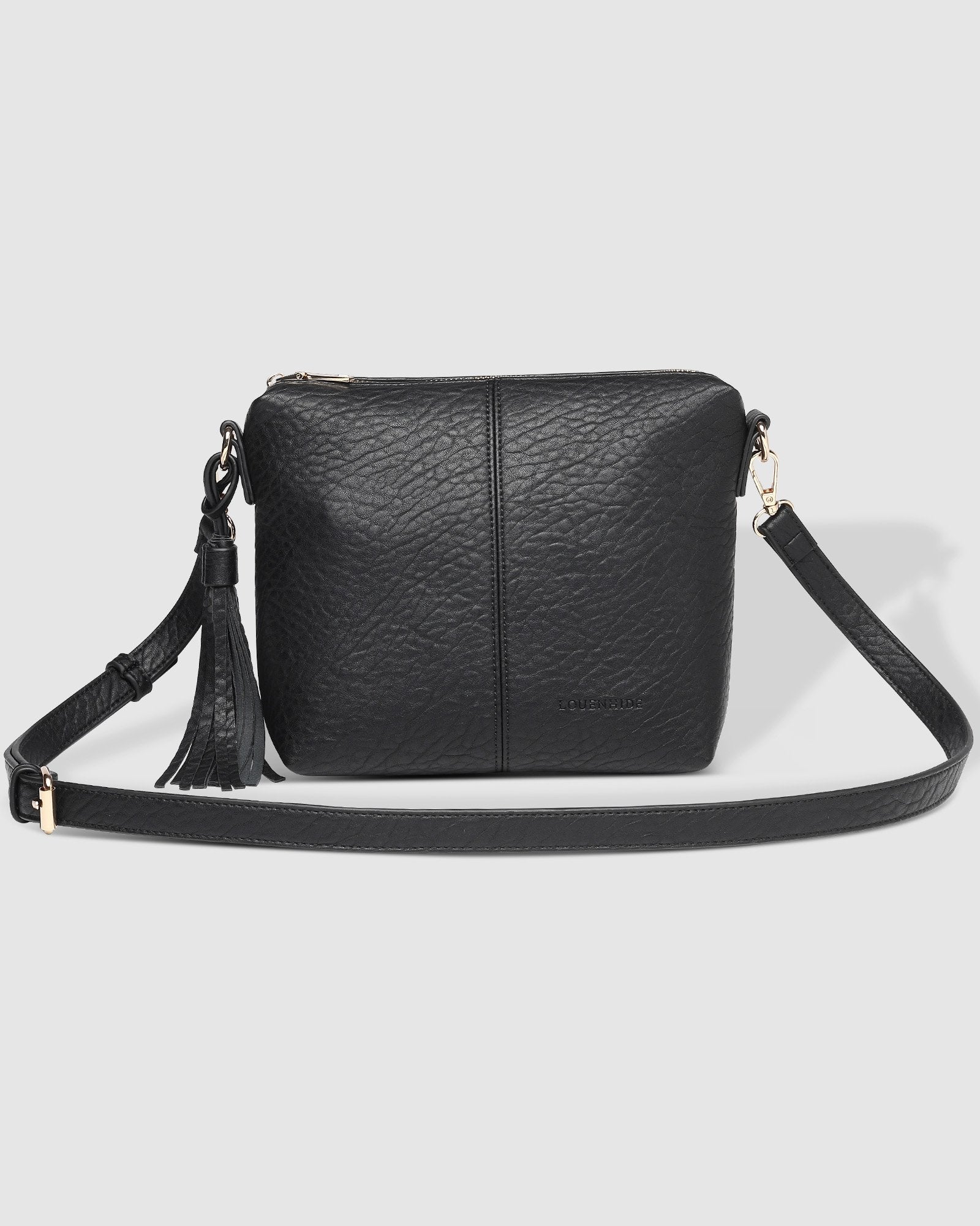 The Louenhide Kasey Textured Crossbody Bag with the Logo Strap is a classic women's everyday bag with elevated style. Designed in a soft and slouchy design, this casual crossbody bag is a smaller take on our best-selling Daisy Crossbody Bag. Secure your favourite products in either the zip pocket, the two slip pockets or in the interior compartment for your bigger items such as sunglasses, purse and phone with ease.