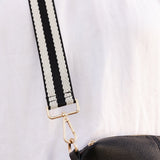 The Louenhide Stripe Guitar Strap is a sporty, yet classic accessory that will never go out of style. This simplicity of the stripe design makes this guitar strap versatile, adding a level of effortless style with the textured webbing finish. Embellished with beautiful light gold hardware and made to be adjusted to your desired length, this strap is a must have to mix and match.