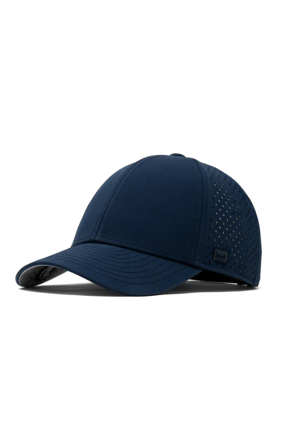 A navy blue baseball cap with a curved brim, featuring perforated side panels and a small black logo patch on the side, set against a plain white background.