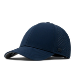 A navy blue baseball cap with a curved brim, featuring perforated side panels and a small black logo patch on the side, set against a plain white background.