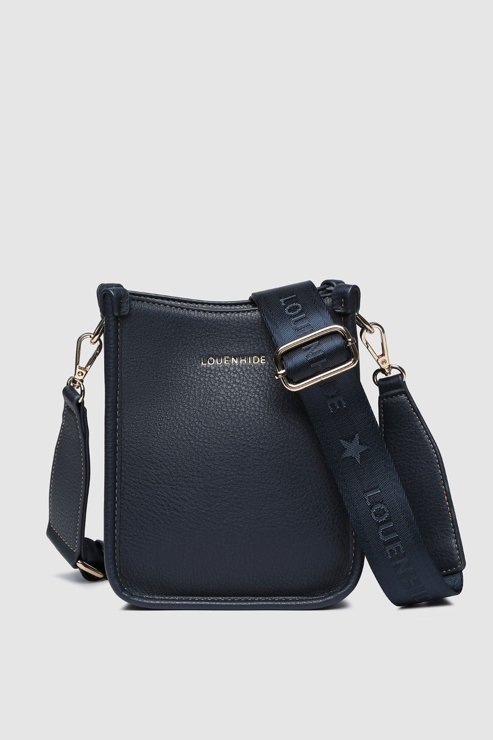 Navy handbag with matching strap on a light gray background