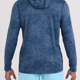 Person wearing a blue patterned hoodie and light blue shorts on a white background