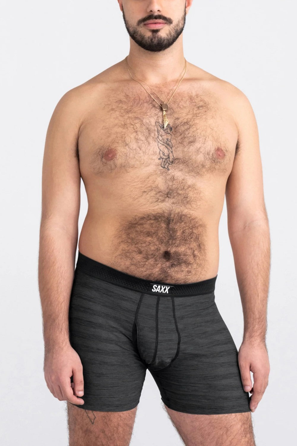 Man wearing black SAXX underwear on a white background