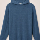 Blue hoodie on a light beige background