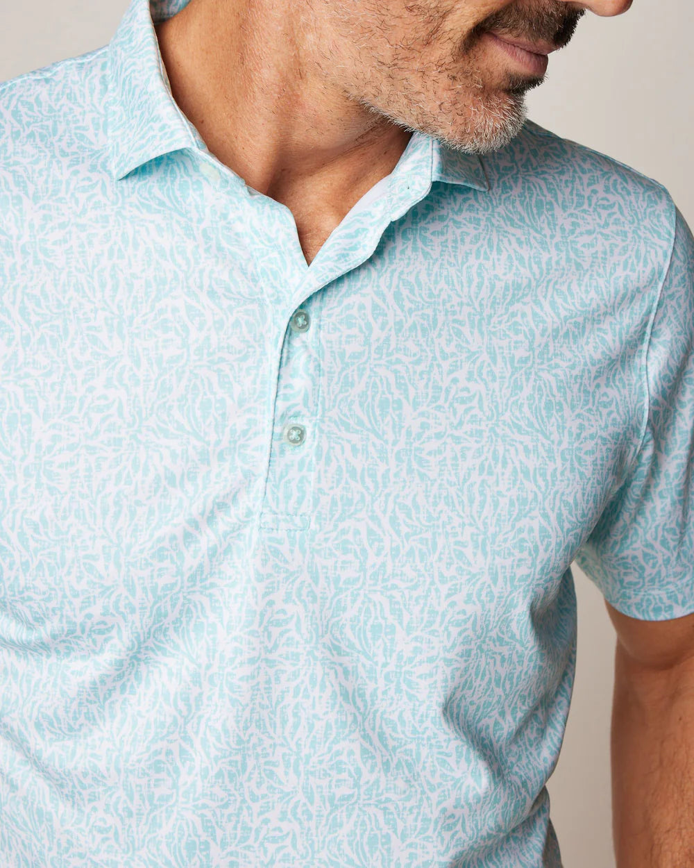 A sharp looking polo with a crisp&nbsp;floral print. Made in our signature performance jersey fabric, the Stines&nbsp;wicks away sweat and moves with you both on and off the course.