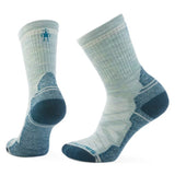 Pair of light and dark green socks on a white background