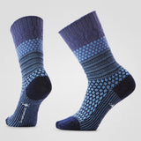 Pair of purple patterned socks on a light blue background