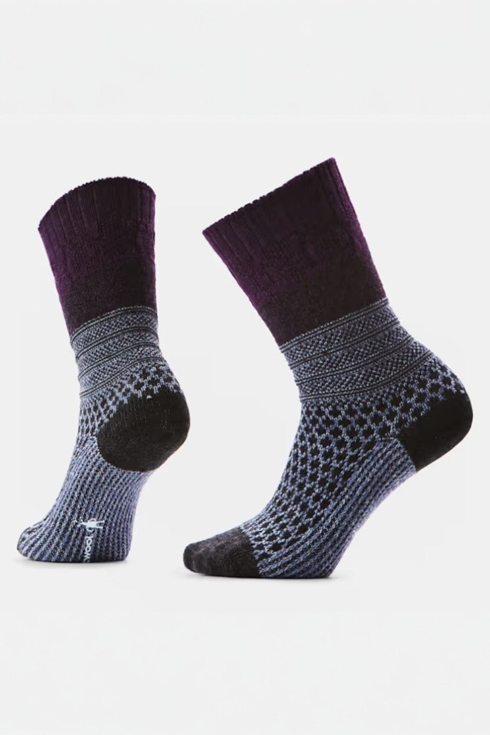 Pair of purple and gray patterned socks on a light gray background