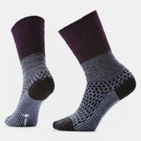 Pair of purple and gray patterned socks on a light gray background