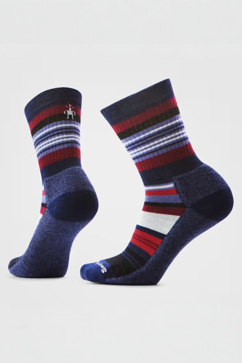 Pair of striped socks with red, grey, and purple pattern on a light gray background