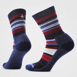 Pair of striped socks with red, grey, and purple pattern on a light gray background
