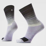 Pair of gray and black striped socks on a light purple background