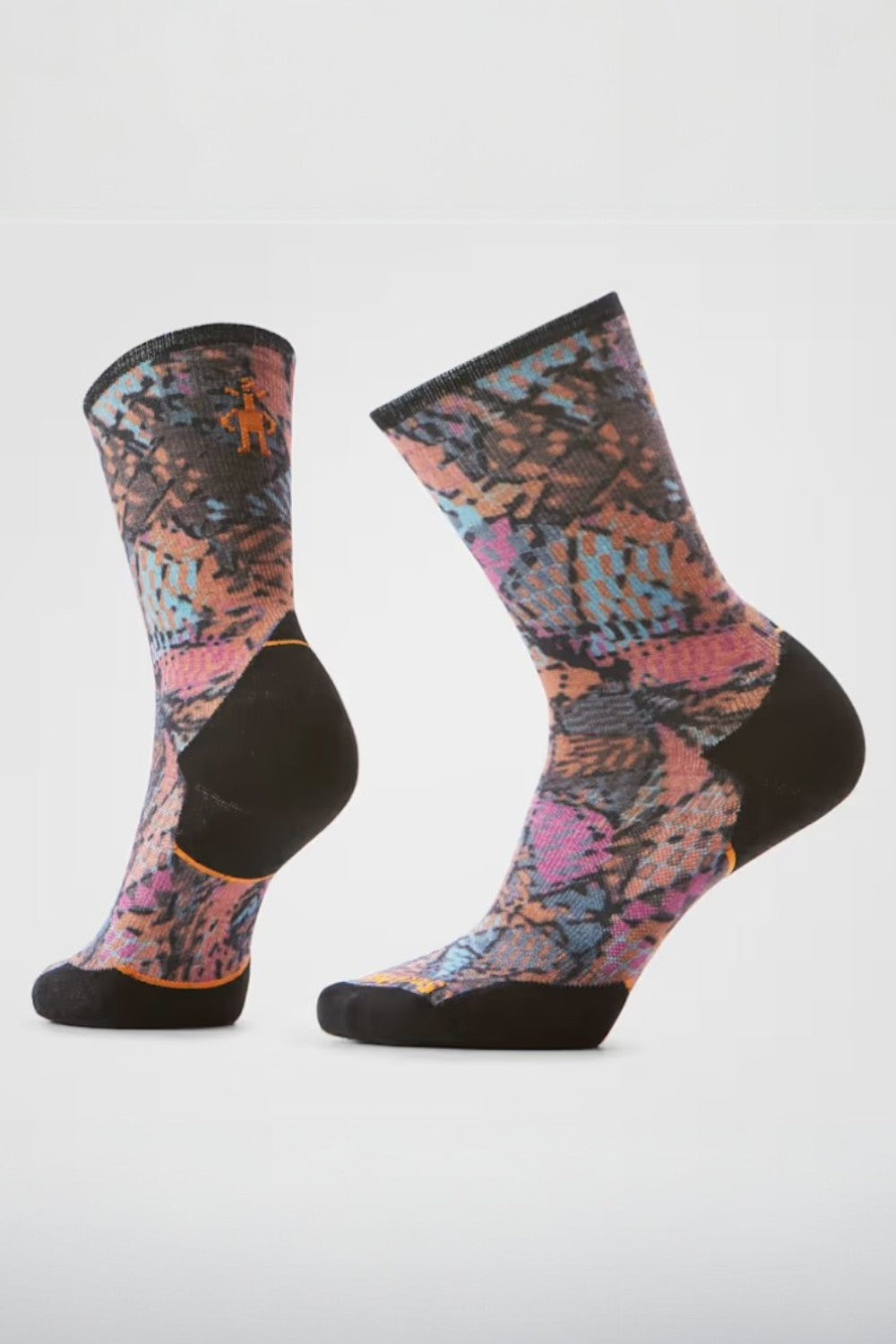 Pair of colourful patterned socks on a white background