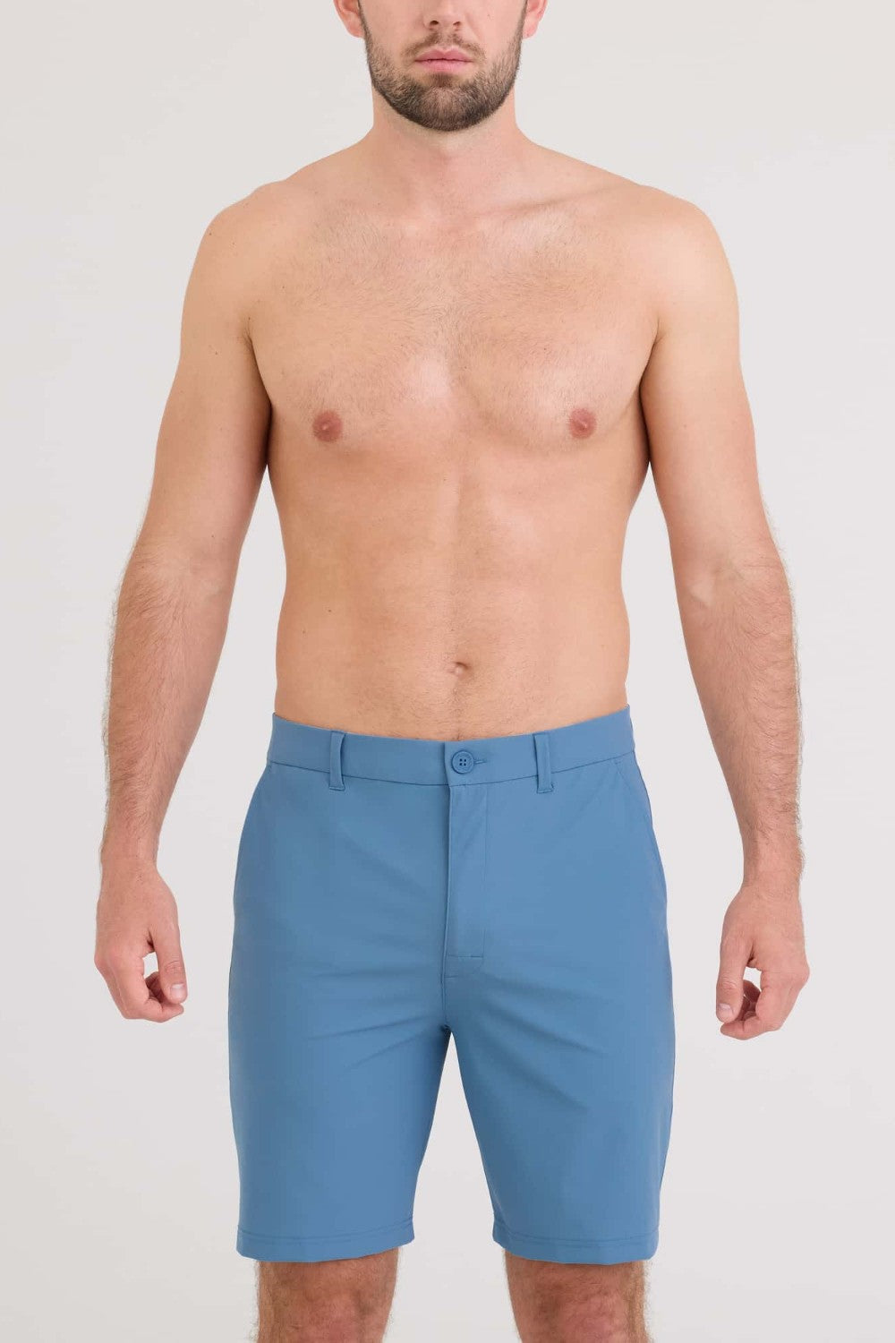 Man wearing blue shorts on a white background