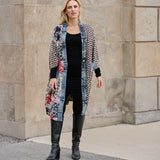 The Janis Cardigan by Shannon Passero. Crafted from eclectic mix of fabrics and designed with an extra long length, this lightweight cardigan will keep you warm without weighing you down! Perfect for those breezy days when you need just the right touch of layers. Get wrapped up in the Janis! Trimmed with denim!