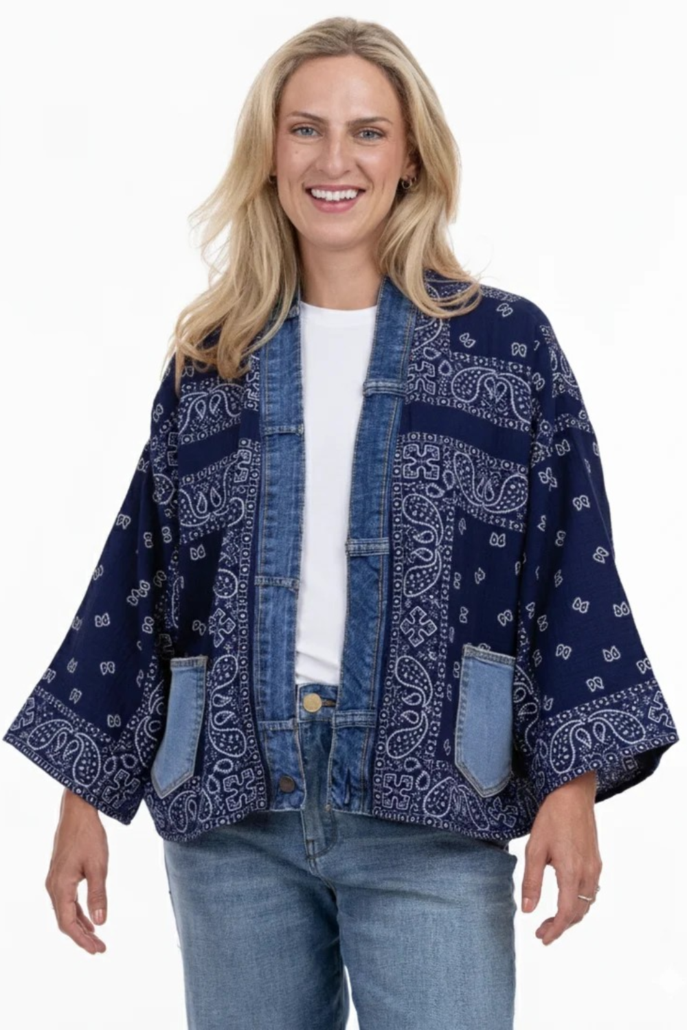 Woman wearing a blue patterned jacket on a white background