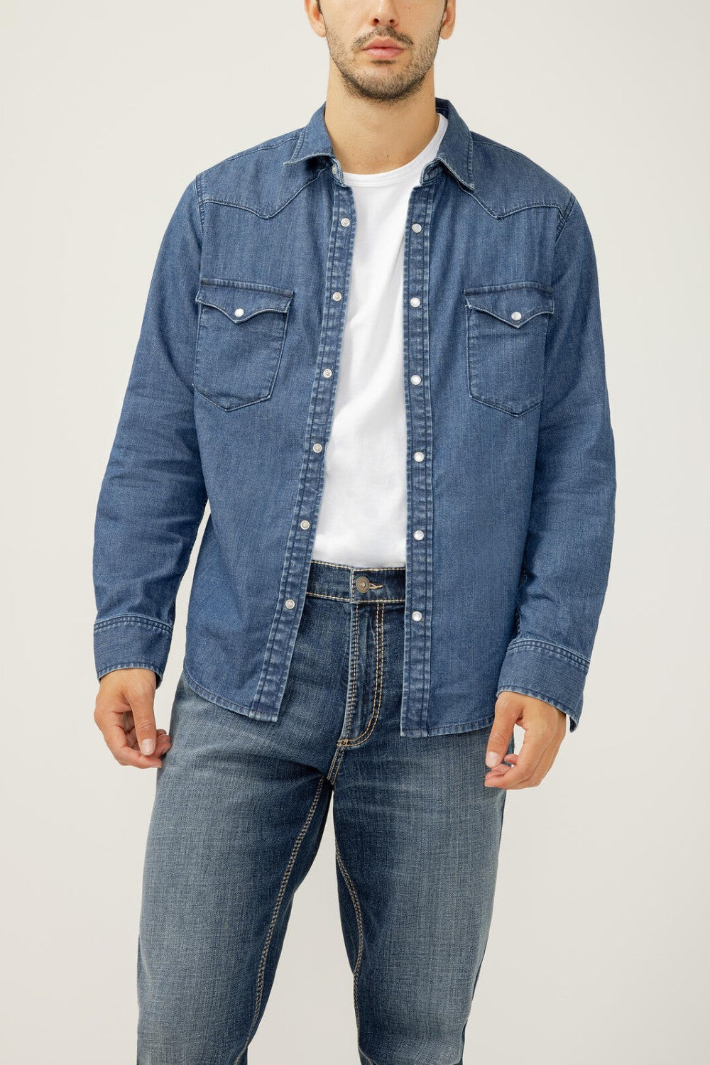 Lean into the classics with a denim shirt featuring western-inspired details like pointed seams, snap buttons and flap pockets. Layer it or let it stand alone, this is a piece you can repeat and remix year-round.