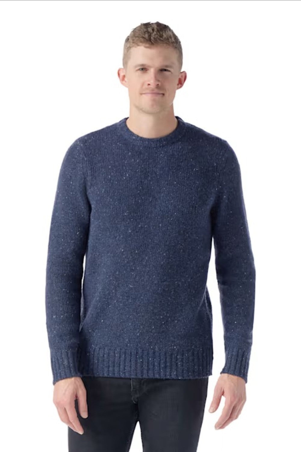 Man wearing a blue knitted sweater on a white background