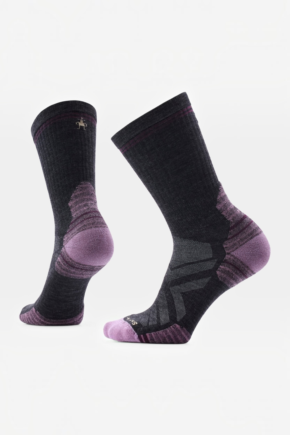 A pair of Smartwool crew socks in black and purple, showing the textured knit, heel support, and toe areas against a plain white background.