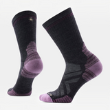 A pair of Smartwool crew socks in black and purple, showing the textured knit, heel support, and toe areas against a plain white background.