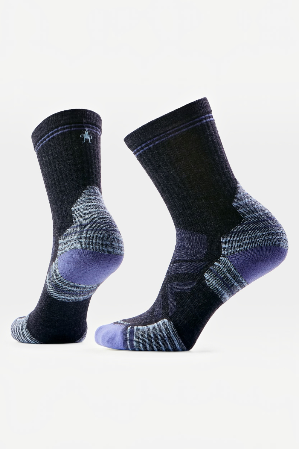 A pair of crew-length athletic socks in black with heathered gray striped zones and purple accents on the heel, toe, and sole, shown against a plain white background.