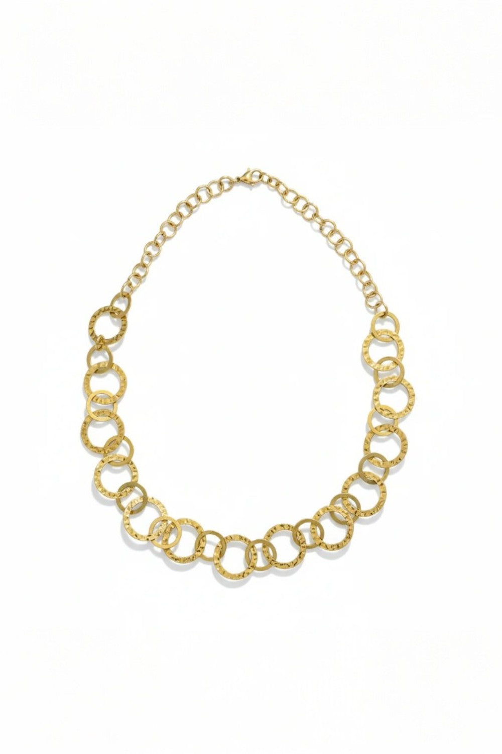 Gold necklace with circles looped together on white background
