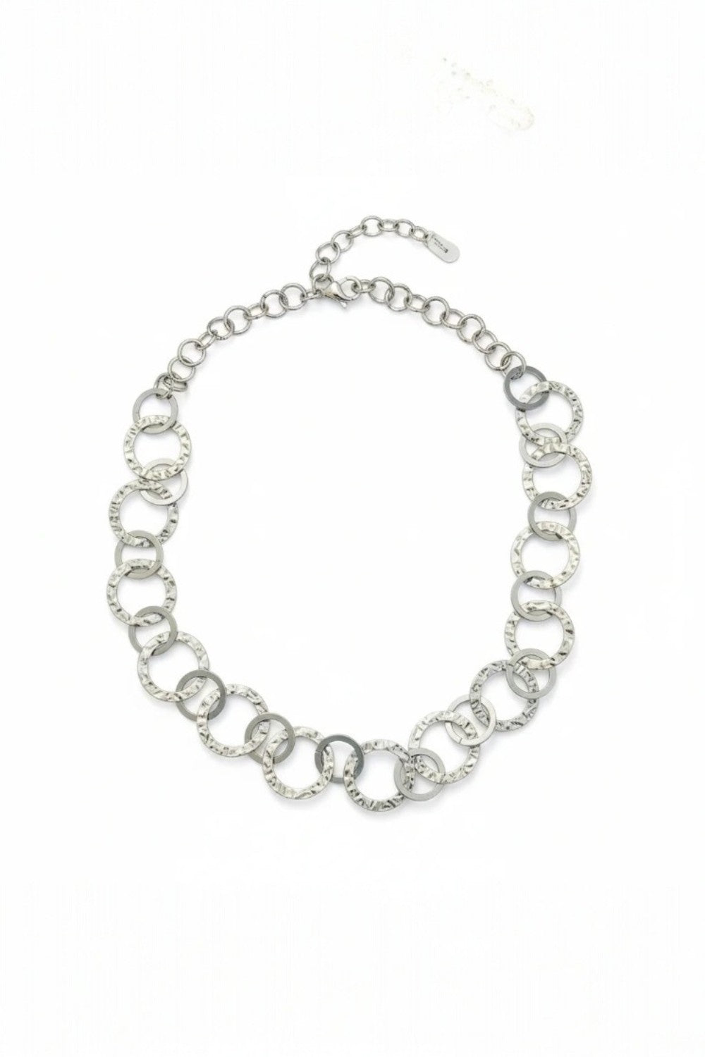 Silver chain necklace on a white background