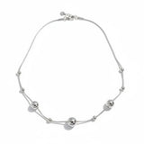 Silver necklace with spherical beads on a white background