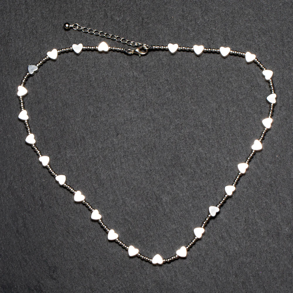 This Suzie Blue Short Heart Necklace in Silver Plate is the perfect way to show off your fashionable style!