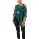 Woman wearing a green poncho and black leggings on a white background