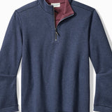 Blue pullover with maroon interior on a white background