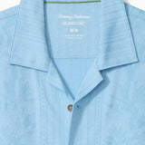 Light blue shirt with collar and brand logo on a white background