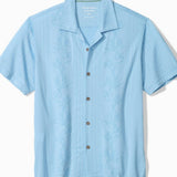 Light blue short-sleeve shirt with buttons on a white background