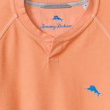 Orange shirt with Tommy Bahama logo on a light blue background