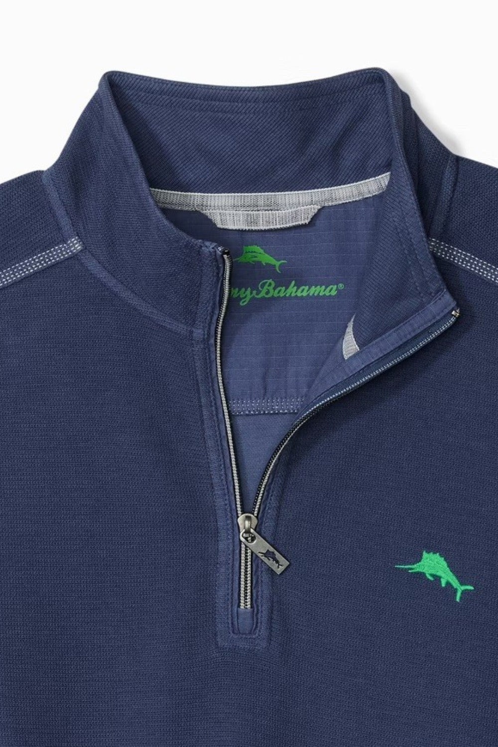 Navy blue pullover with a zipper and green logo on a white background
